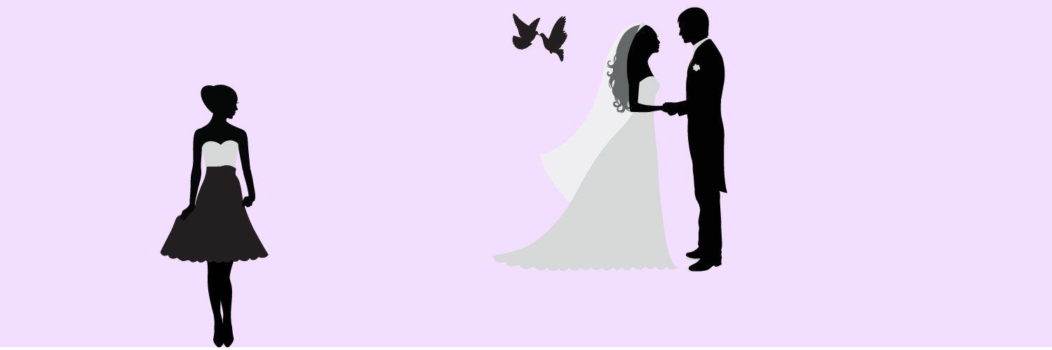 A wedding planner standing off to the side while she watches her clients get married with doves flying above them.
